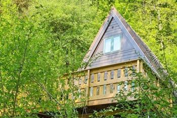 Houten chalets van Les Jardins de Durbuy boeken